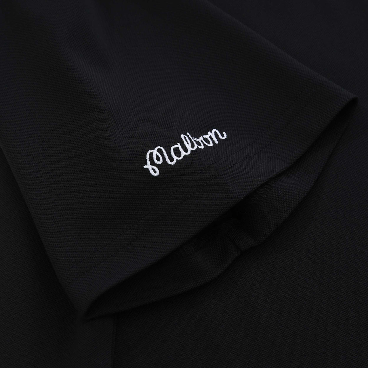 Malbon Fairway Baldwin Polo Shirt in Black Sleeve Logo